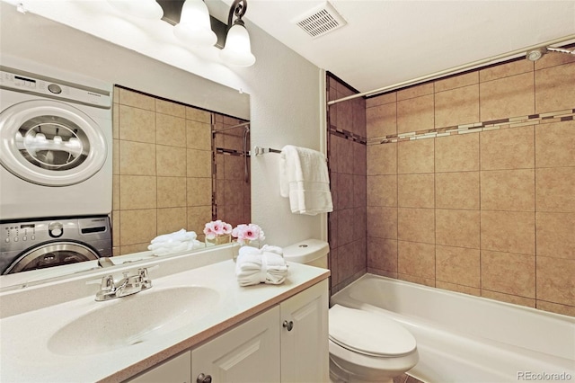 3341 S Monaco Pkwy Unit A, Denver, CO 80222 - full bathroom with estacked washer and dryer, toilet, vanity, and bathtub / shower combination