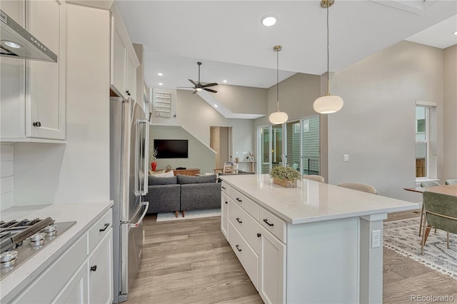 6366 N Emporia St, Denver, CO 80238 - kitchen with open floor plan, appliances with stainless steel finishes, ventilation hood, ceiling fan, and white cabinets