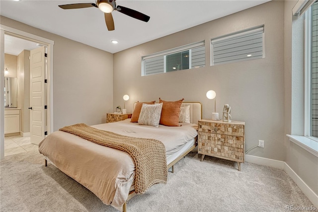 6366 N Emporia St, Denver, CO 80238 - carpeted bedroom featuring connected bathroom, ceiling fan, and recessed lighting