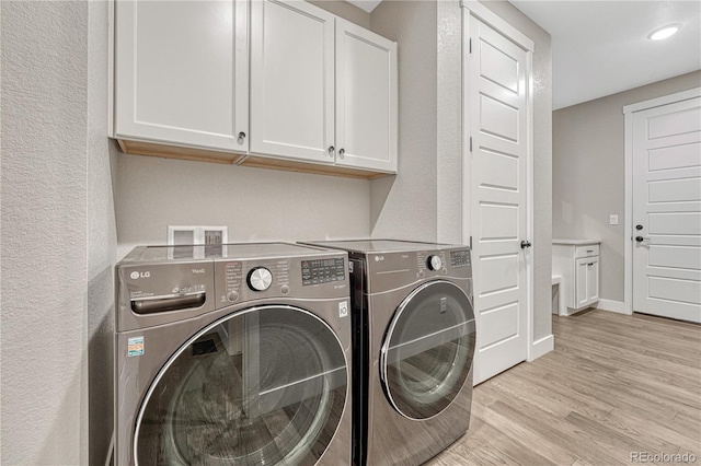 6366 N Emporia St, Denver, CO 80238 - laundry room featuring cabinet space, washer and dryer, light wood finished floors, a textured wall, and recessed lighting