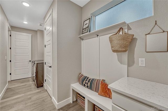 6366 N Emporia St, Denver, CO 80238 - mudroom with light wood-type flooring, recessed lighting, and a textured wall