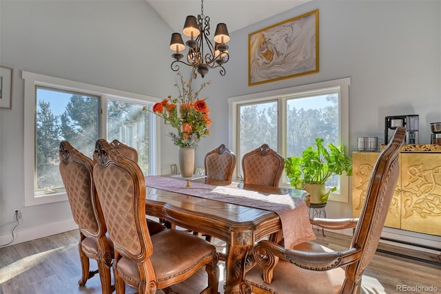 2770 Rossmere St, Colorado Springs, CO 80919 - dining room with a chandelier, high vaulted ceiling, and wood finished floors
