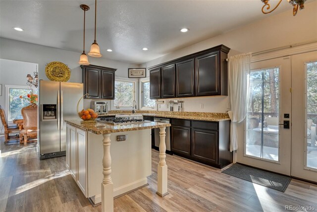 2770 Rossmere St, Colorado Springs, CO 80919 - kitchen featuring stainless steel appliances, plenty of natural light, light wood-type flooring, dark brown cabinetry, and recessed lighting