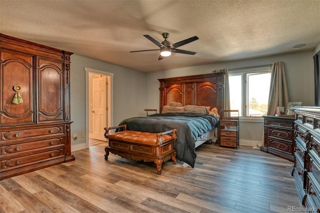 2770 Rossmere St, Colorado Springs, CO 80919 - bedroom featuring a textured ceiling, wood finished floors, and ceiling fan