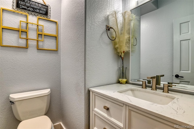 2770 Rossmere St, Colorado Springs, CO 80919 - bathroom featuring vanity and a textured wall
