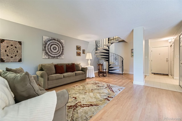 7020 E Girard Ave Unit 206, Denver, CO 80224 - living room with stairway and light wood-type flooring