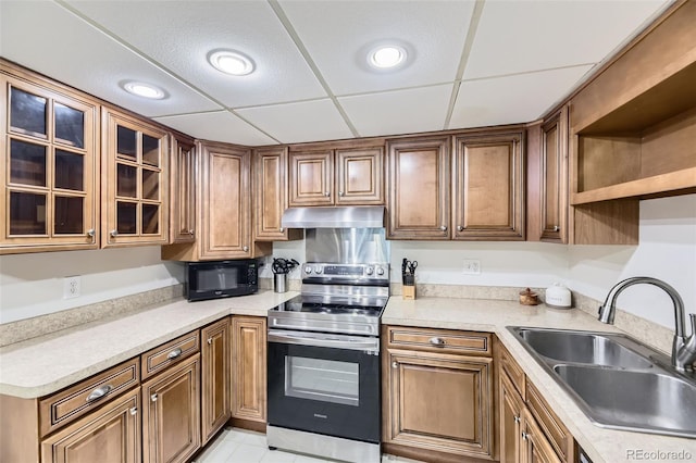 7020 E Girard Ave Unit 206, Denver, CO 80224 - kitchen featuring electric range, under cabinet range hood, black microwave, light countertops, and recessed lighting
