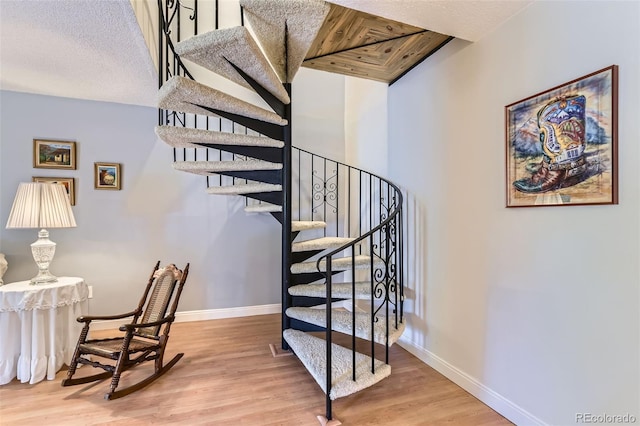 7020 E Girard Ave Unit 206, Denver, CO 80224 - staircase featuring wood finished floors and baseboards