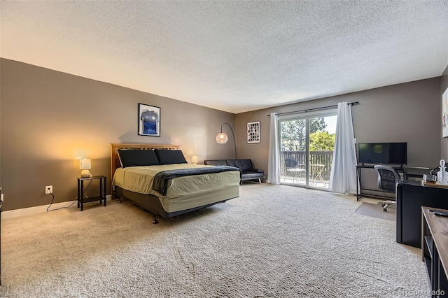 7020 E Girard Ave Unit 206, Denver, CO 80224 - carpeted bedroom with access to exterior and a textured ceiling