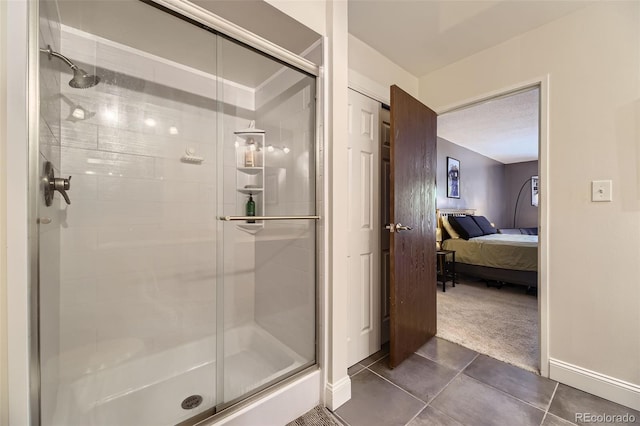 7020 E Girard Ave Unit 206, Denver, CO 80224 - full bath with connected bathroom, a stall shower, and tile patterned floors