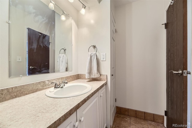 7020 E Girard Ave Unit 206, Denver, CO 80224 - bathroom featuring vanity and baseboards