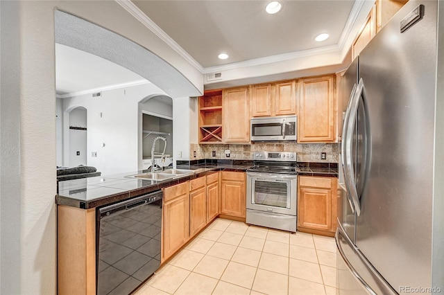 kitchen featuring appliances with stainless steel finishes, tasteful backsplash, ornamental molding, sink, and light tile patterned floors