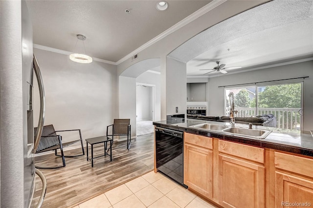 kitchen with sink, stainless steel refrigerator with ice dispenser, ceiling fan, black dishwasher, and light tile patterned flooring