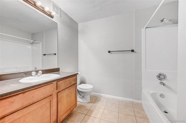 full bathroom featuring washtub / shower combination, tile patterned floors, a textured ceiling, toilet, and vanity