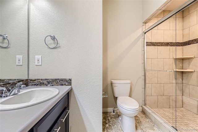 2564 Sweet Wind Ave, Castle Rock, CO 80109 - full bathroom featuring a stall shower, toilet, vanity, and baseboards