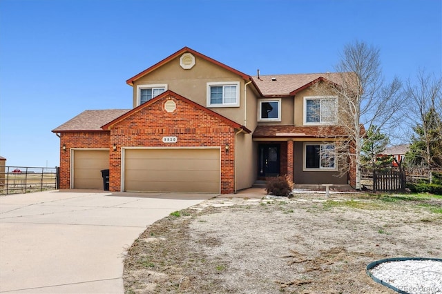 9920 Glenellen Dr, Peyton, CO 80831 - traditional-style home featuring a garage, stucco siding, fence, brick siding, and concrete driveway