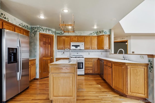 9920 Glenellen Dr, Peyton, CO 80831 - kitchen featuring a sink, light countertops, a center island with sink, and stainless steel appliances