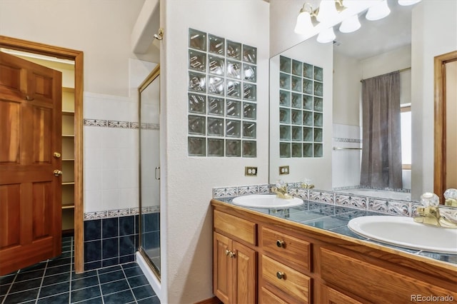 9920 Glenellen Dr, Peyton, CO 80831 - full bath with a sink, tile patterned floors, and a stall shower