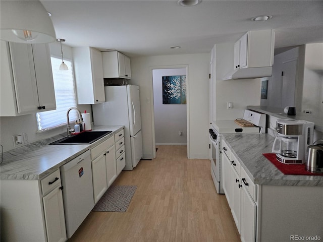 kitchen with pendant lighting, sink, white appliances, light hardwood / wood-style floors, and white cabinets