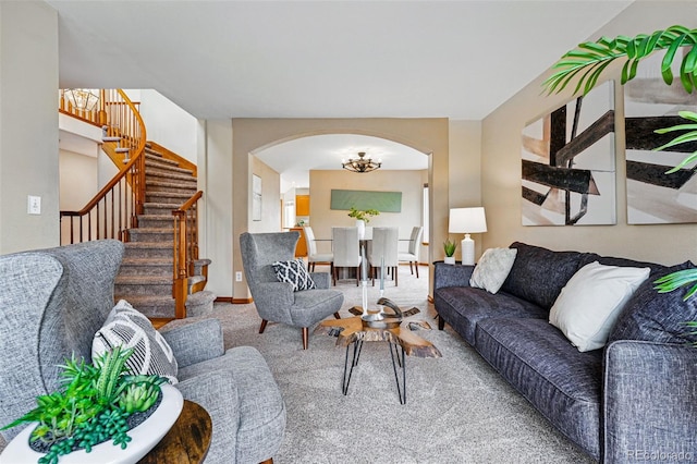 9515 Dolton Way, Highlands Ranch, CO 80126 - living room with arched walkways, stairs, carpet flooring, and a chandelier