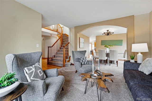 9515 Dolton Way, Highlands Ranch, CO 80126 - living area with arched walkways, stairs, a chandelier, and wood finished floors