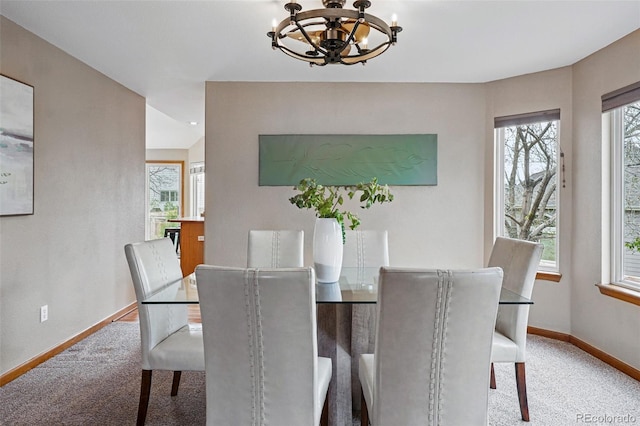 9515 Dolton Way, Highlands Ranch, CO 80126 - carpeted dining space with a chandelier and baseboards
