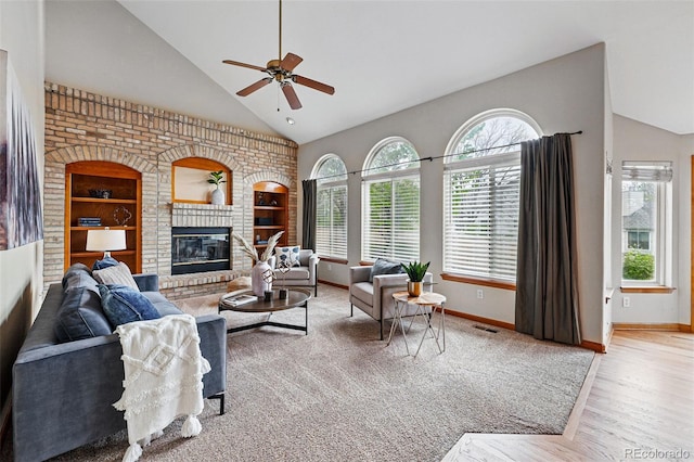 9515 Dolton Way, Highlands Ranch, CO 80126 - living area featuring plenty of natural light, a ceiling fan, baseboards, and high vaulted ceiling