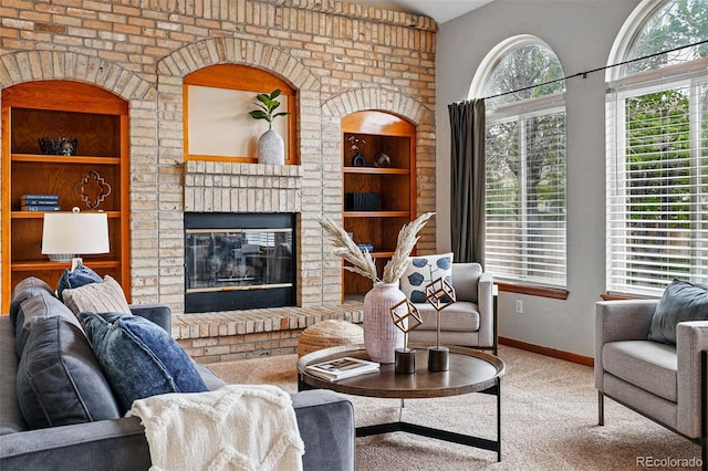 9515 Dolton Way, Highlands Ranch, CO 80126 - living area featuring carpet, a brick fireplace, baseboards, and built in shelves
