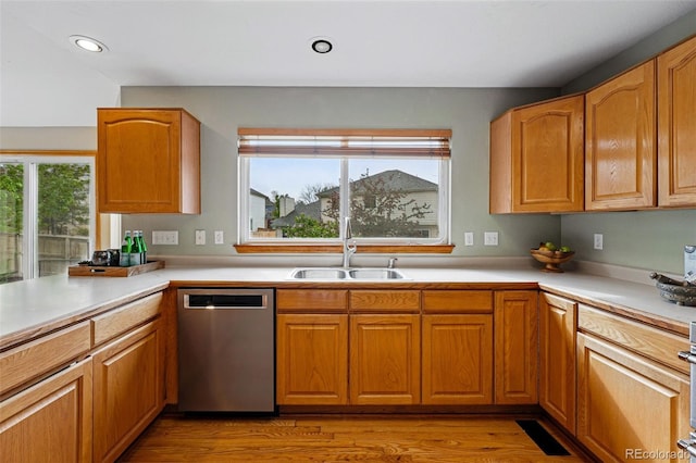 9515 Dolton Way, Highlands Ranch, CO 80126 - kitchen featuring stainless steel dishwasher, a sink, light countertops, recessed lighting, and light wood-type flooring