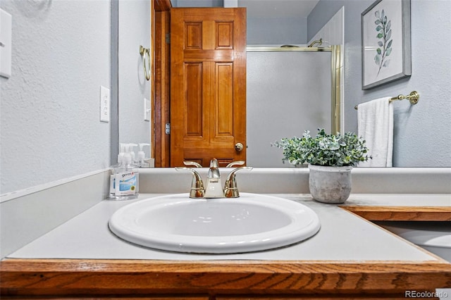 9515 Dolton Way, Highlands Ranch, CO 80126 - full bath featuring a stall shower, vanity, and a textured wall
