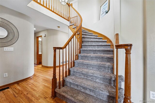9515 Dolton Way, Highlands Ranch, CO 80126 - stairway featuring wood finished floors and baseboards