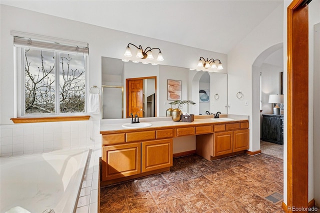 9515 Dolton Way, Highlands Ranch, CO 80126 - bathroom with double vanity, a bath, and an enclosed shower