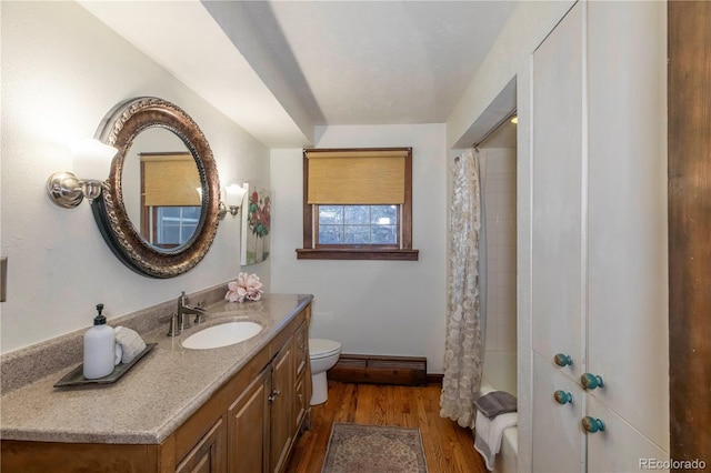 full bathroom with toilet, shower / tub combo, vanity, and hardwood / wood-style flooring