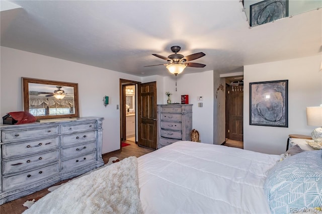 bedroom featuring wood-type flooring, ensuite bathroom, and ceiling fan