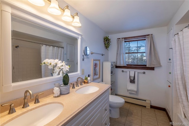 bathroom featuring toilet, tile patterned flooring, a baseboard heating unit, and vanity