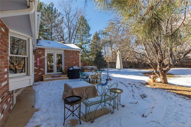 view of snow covered patio