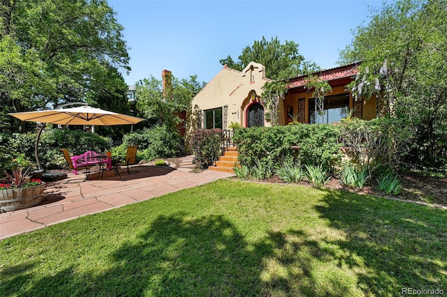 1332 Ash St, Denver, CO 80220 - view of green lawn featuring a patio
