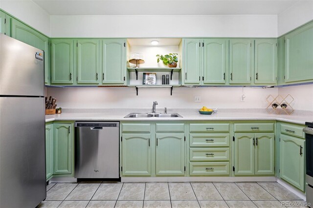 1332 Ash St, Denver, CO 80220 - kitchen featuring appliances with stainless steel finishes, green cabinetry, and light countertops
