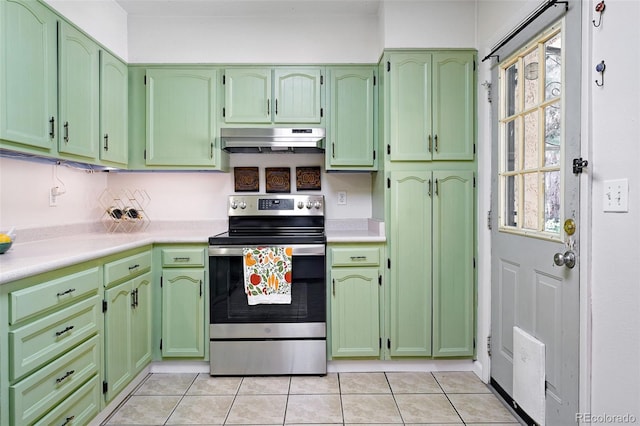 1332 Ash St, Denver, CO 80220 - kitchen featuring stainless steel range with electric cooktop, under cabinet range hood, green cabinets, and light countertops