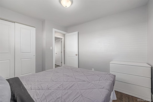 bedroom with a closet and wood finished floors