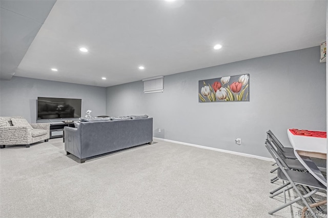 living area featuring light colored carpet, recessed lighting, and baseboards