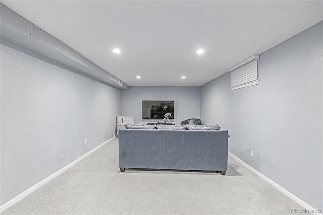 living room with light colored carpet, recessed lighting, and baseboards