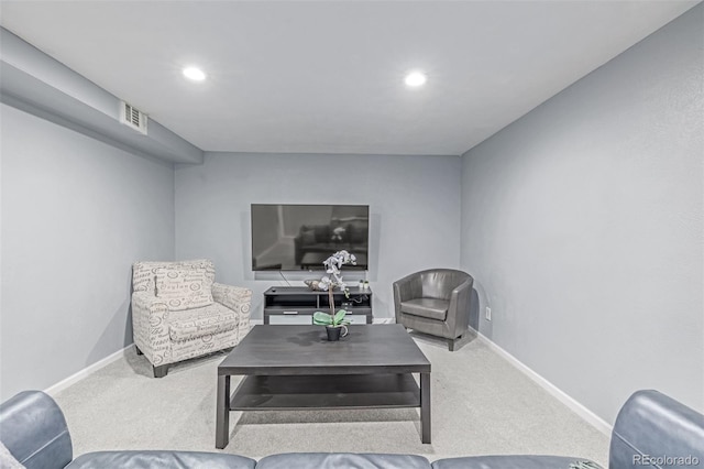 living room with carpet floors, recessed lighting, and baseboards