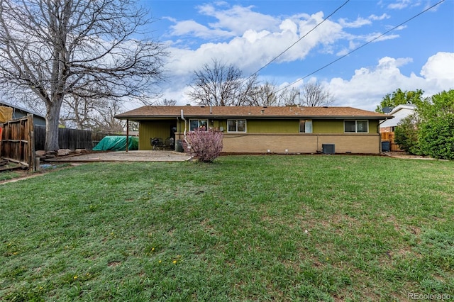 rear view of property with central air condition unit, a patio, and brick siding