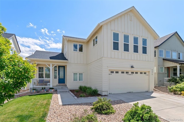 4670 Tanner Peak Trl, Brighton, CO 80601 - view of front of property with board and batten siding, concrete driveway, an attached garage, covered porch, and a front yard