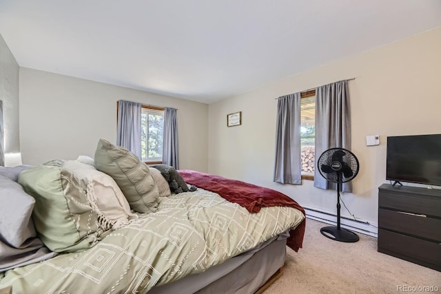 bedroom featuring carpet flooring and baseboard heating