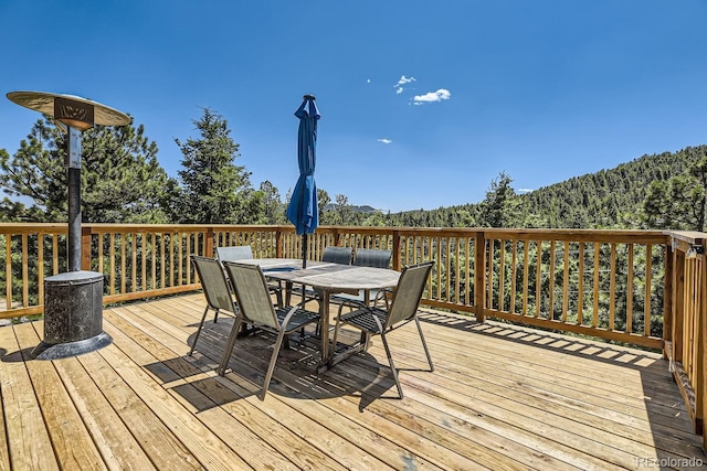 deck featuring outdoor dining area