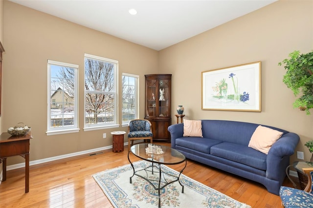 living room with light hardwood / wood-style flooring