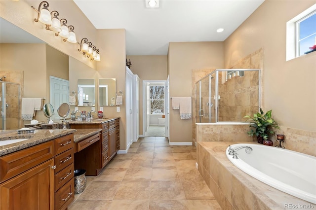 bathroom with tile patterned flooring, vanity, and separate shower and tub