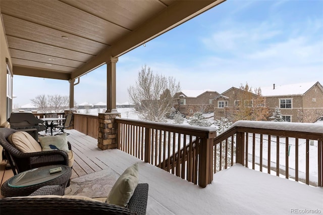 view of snow covered deck